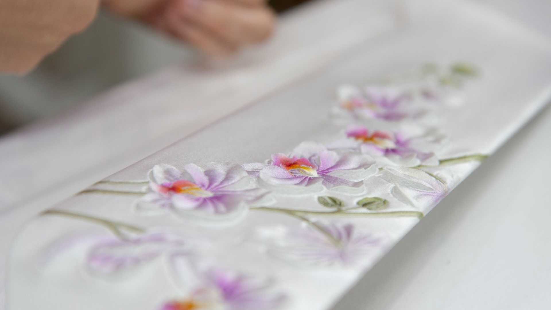 Rolls-Royce Phantom Orchid's hand-sculpted silk artwork comes featuring Grace White, Havana, and Smoke Grey with Dark Olive stitching. Rolls-Royce Phantom Orchid's hand-sculpted silk artwork comes featuring Grace White, Havana, and Smoke Grey with Dark Olive stitching.