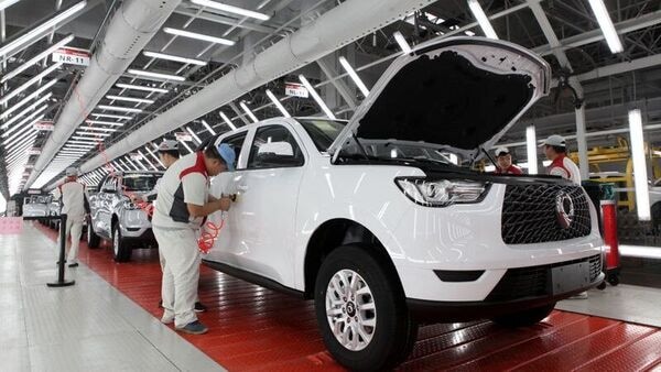 Workers inspect vehicles at a workshop of a production base of Great Wall Motors in Yongchuan. (File photo used for representation purpose only) (REUTERS)