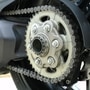 A motorcycle chain needs a timely maintenance. It needs to be cleaned and properly lubricated every 500-600 kms.