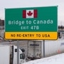 Commercial Trucks idle on the side of the expressway after the Ambassador Bridge to Canada shut down in Detroit, Michigan. (REUTERS)
