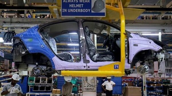 File photo of workers assemble a Tata Tigor car inside the Tata Motors car plant in Sanand. (REUTERS)