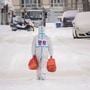 File photo: A police officer wearing personal protective equipment carries food and daily supplies that will be distributed to residents at a restricted residential area due to the spread of the Covid-19 coronavirus in Manzhouli in China's northern Inner Mongolia region. (AFP)