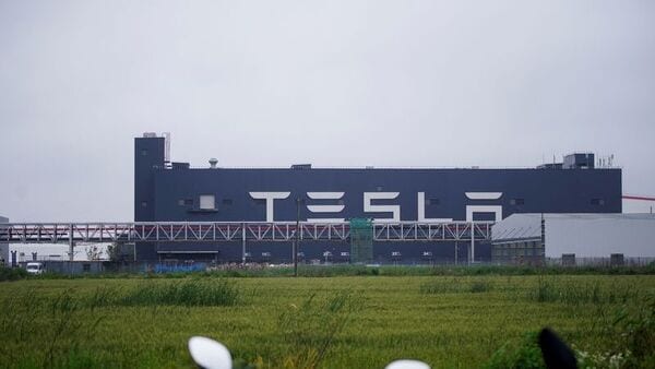 File photo: A Tesla sign is seen at its factory in Shanghai, China, (REUTERS)