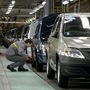 A worker examines new cars at Renault's Moscow plant. (File photo) (AP)