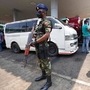 A Sri Lankan army soldier secures a fuel pump as people wait to buy diesel in Colombo. (AP)