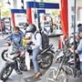 Motorcyclists wait in queues to get their vehicles filled with fuel, at a petrol pump in Navi Mumbai. (PTI file) (HT_PRINT)