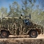 In this file photo provided by the Australian Defense Force, an Australian Army Bushmaster armored vehicle moves off road during a training mission. (AP)