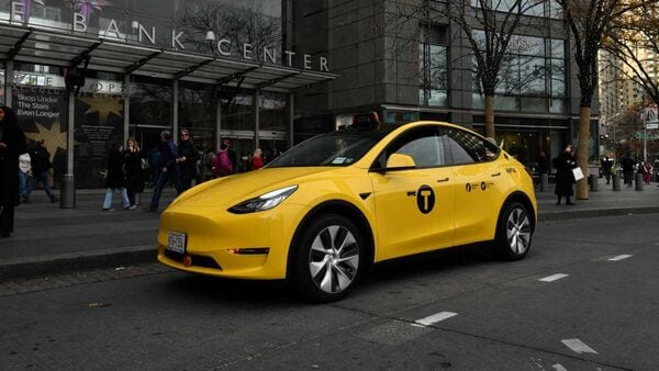 The Gravity Tesla Model Y yellow taxi.