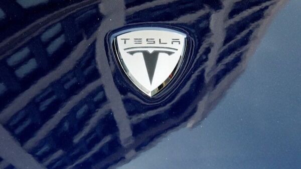 File photo: A logo of Tesla Motors on an electric car model (REUTERS)