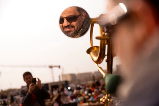Mohamed Wahdan is reflected on the mirror of a 1924 Ford T at a public show in Cairo. Mohamed Wahdan is reflected on the mirror of a 1924 Ford T at a public show in Cairo.