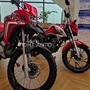 Honda XRE300 Rally (left), Titan CG (right) flex fuel bikes displayed at a special media event in Gurugram.&nbsp;