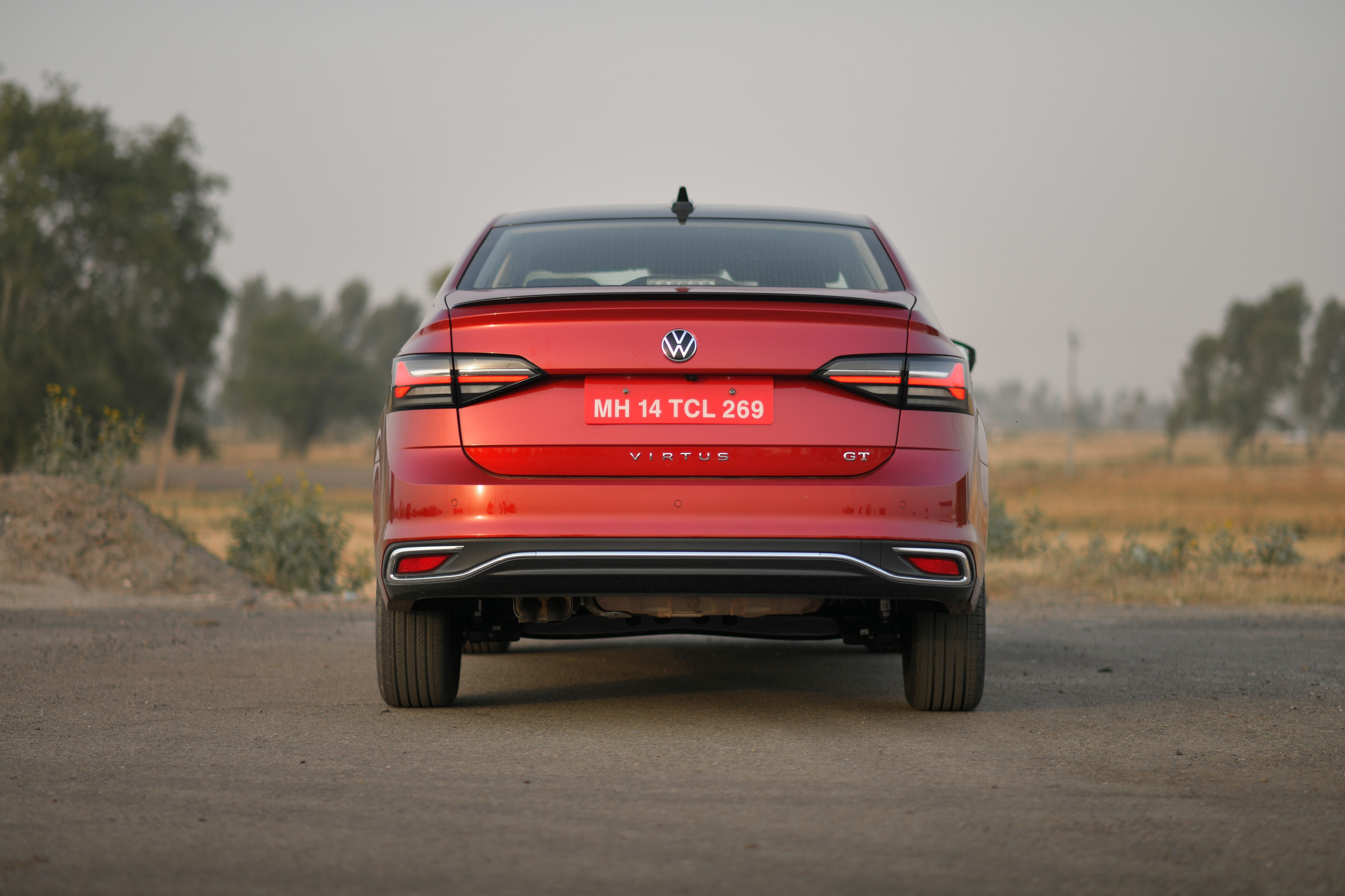The rear of the Volkswagen Virtus sedan comes with a wraparound LED taillights with the VW badge. The rear of the Volkswagen Virtus sedan comes with a wraparound LED taillights with the VW badge.