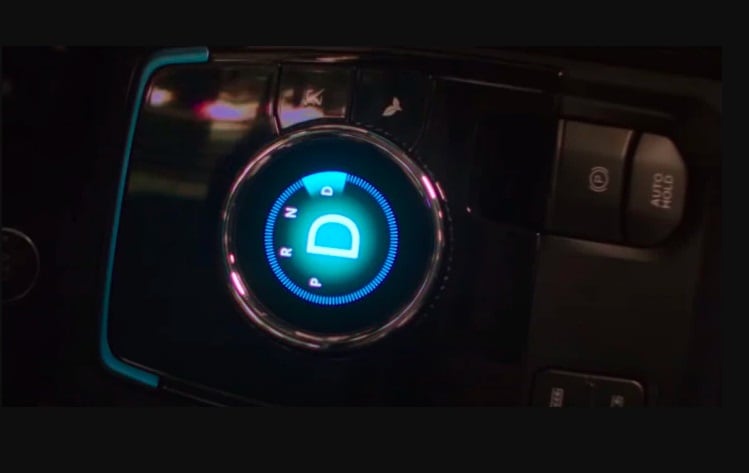 Instead of a rotary gear selector, there is a new screen displaying P-R-N-D. 