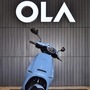 File photo of Ola Electric logo and it's flagship electric scooter. (AFP)