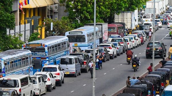 Vehicles queue along a street to buy petrol at Ceylon petroleum corporation fuel station in Colombo. (AFP)