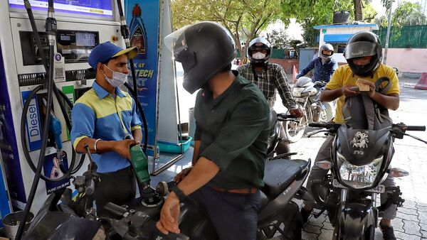 A petrol pump staff refills fuel in a two-wheeler in New Delhi. (ANI)
