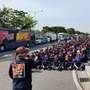 Members of the Cargo Truckers Solidarity union attend a protest in front of Hyundai Motor's factory in Ulsan, South Korea.