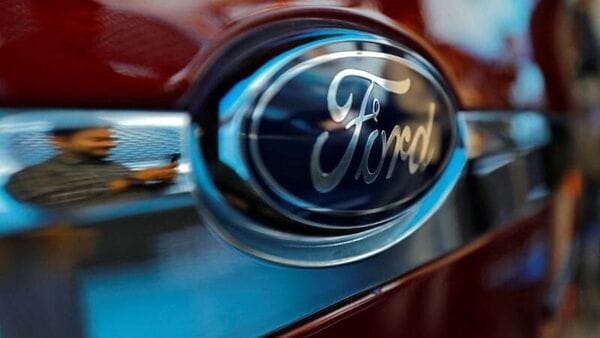 A visitor is reflected as he takes pictures of a new Ford Aspire car during its launch in New Delhi, India, October 4, 2018. (File photo) (REUTERS)