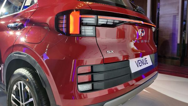 At the back, the new tail light units of the 2022 Hyundai Venue are connected to each other with a single-piece light strip all across the boot body. The rear bumper too has been updated and there is a faux skid plate.