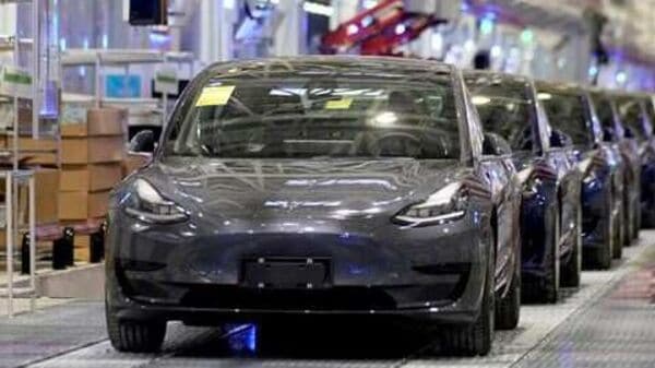 Tesla China-made Model 3 vehicles are seen during a delivery event at its factory in Shanghai. (File Photo) (REUTERS)