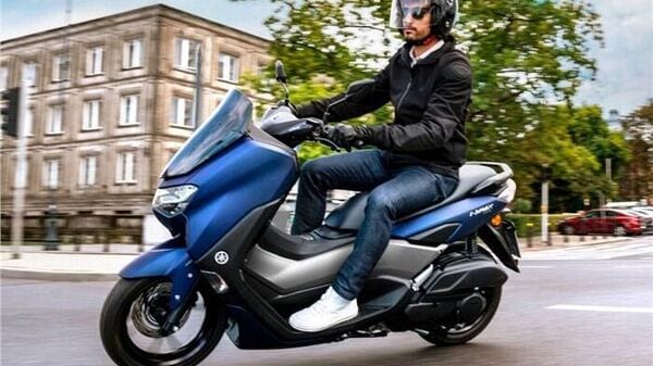 The Yamaha NMax 155 focuses more on maxi-scooter design than the Aerox 155.