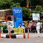 File photo: Volunteers hold placards at a traffic point as part of the Delhi government Red Light On, Gaadi Off campaign to reduce pollution level in the national capital. (ANI)