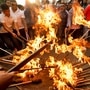 Demonstrators affiliated with the main opposition take part in a torch rally during the protest against the rise in fuel prices in Kathmandu, Nepal. (REUTERS)