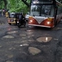 Motorists navigate potholes resurfaced on Aarey Dairy road due to heavy rainfall in Mumbai. (Photo by Vijay Bate/HT Photo) (HT PHOTO)