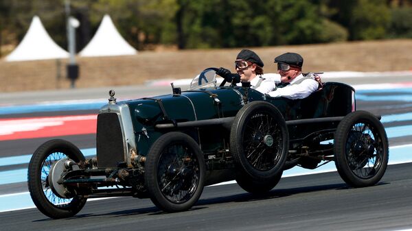 Aston Martin marked the centenary of its maiden challenge at the 1922 French Grand Prix as four-time world champion Sebastian Vettel took the original Green Pea for a spin on the track for a celebratory lap.