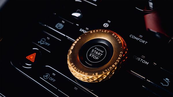 The metallic elements of the interior are a blend of Black Anodised Aluminium and Satin Titanium. It also features a hallmarked 18 karat gold Bentley Dynamic Drive Selector and ‘12 o'clock' steering wheel centre band.