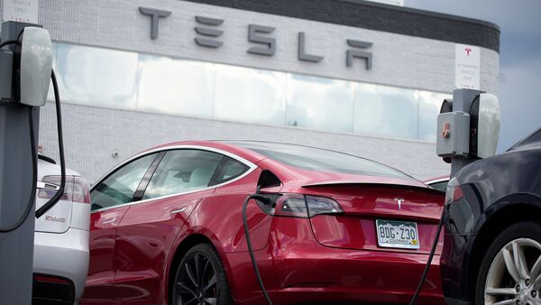 A file photo of a Tesla electric car being charged.  (AP)