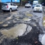 Motorists navigate huge potholes on the road near Grand Hyatt Hotel in Santacruz, Mumbai. The Ministry of Road Transport and Highways (MoRTH) shared a report recently which says that road accidents caused by potholes led to death of 5,626 people between 2018 and 2020. (HT PHOTO)