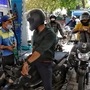 A petrol pump staff refills fuel in a two-wheeler in New Delhi. (ANI)
