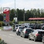 Car drivers queue to fill their fuel tanks at gasoline pumps at Auchan gas station in Petite-Foret, France. (REUTERS)