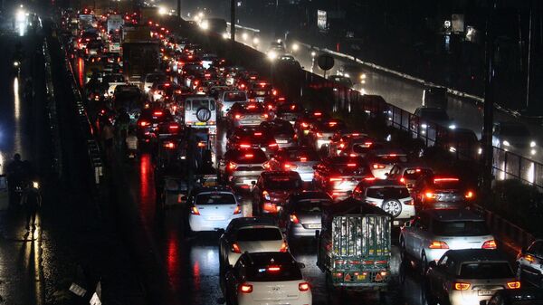 Heavy traffic jam due to waterlogging at Delhi-Gurgaon Expressway during heavy rains, in Gurugram on Saturday.