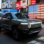 File photo: A Rivian R1T pickup, the Amazon-backed electric vehicle (EV) maker, is driven through Times Square during the company’s IPO in New York City. (REUTERS)
