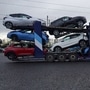 File photo of newly manufactured cars leaving on a transporter from the Nissan Motor plant in Sunderland, UK. (Bloomberg)