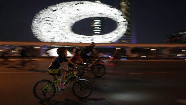 Bicyclists ride past the Museum of the Future and Emirates Towers, in Dubai. Thousands of people take part in annual Dubai Ride on the skyscraper-lined super highway that cuts through the center of the city. Bicyclists ride past the Museum of the Future and Emirates Towers, in Dubai. Thousands of people take part in annual Dubai Ride on the skyscraper-lined super highway that cuts through the center of the city.