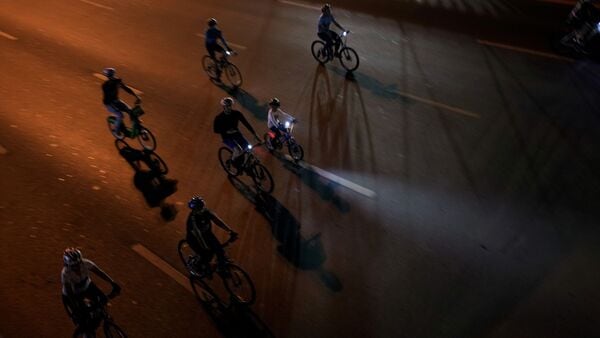 Bikes raced down the Sheikh Zayed Road, a 10-lane asphalt jungle that gives drivers a view of the world's tallest building and other sites. Bikes raced down the Sheikh Zayed Road, a 10-lane asphalt jungle that gives drivers a view of the world's tallest building and other sites.