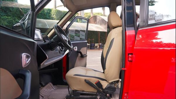 The micro electric car's feature list includes a digital infotainment system, a USB charging port, air conditioning, remote keyless entry and remote park assist.