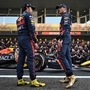 Red Bull's Mexican driver Sergio Perez (left) and Dutch driver Max Verstappen (right) chat before a team photo shoot ahead of the Abu Dhabi Formula One Grand Prix at the Yas Marina Circuit in Abu Dhabi. (AFP)