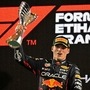 Red Bull's Dutch driver Max Verstappen raises the winner's trophy on the podium after the Abu Dhabi Formula One Grand Prix at the Yas Marina Circuit in the Emirati city of Abu Dhabi. (AFP)