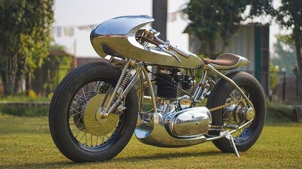 TNT Motorcycles built custom parts for the build.  It is based on the Royal Enfield Electra 350 CI.