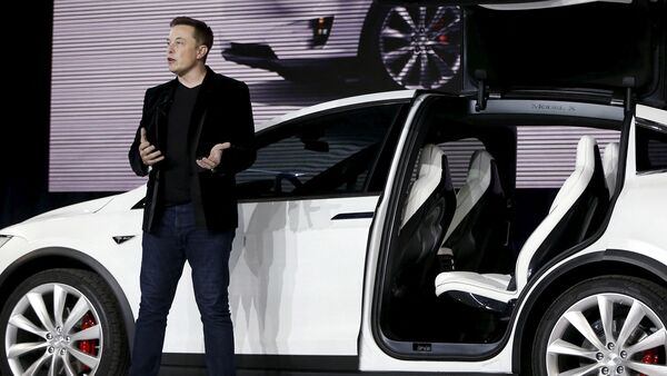 Tesla CEO Elon Musk unveils the falcon wing doors on the Model X electric sport utility vehicle.  (File photo) (Reuters)