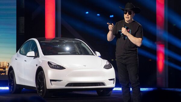 Tesla CEO Elon Musk advises the company's employees not to worry about the stock price plummeting and focus on speeding up deliveries.  (AP)