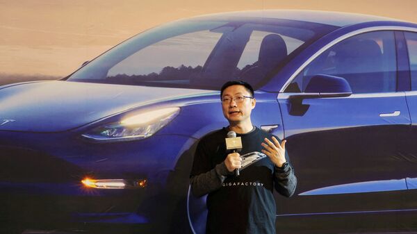 FILE PHOTO: Tesla China CEO Tom Zhu speaks at a delivery ceremony for China-made Tesla Model 3 cars at the Shanghai Gigafactory.