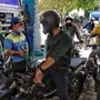 A petrol pump staff refills fuel in a two-wheeler in New Delhi. (ANI)