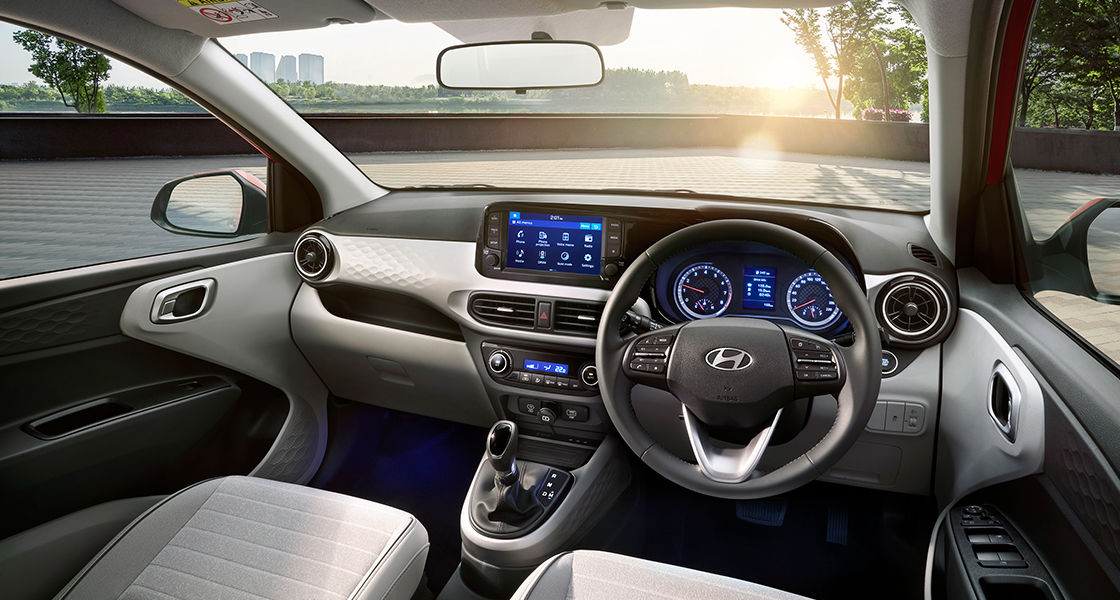 The cabin gets substantial upgrades with a new instrument cluster, wireless charging footwell lighting and more Hyundai Grand i10 Nios Facelift