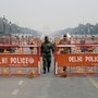 Security personnel stand guard at Kartavya Path ahead of the 74th Republic Day in New Delhi. Delhi Police has issued traffic advisory for parade dress rehearsal on Monday. (Ishant)