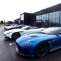 Aston Martin Lagonda cars parked outside the carmaker's new factory in Britain. (File Photo) (REUTERS)